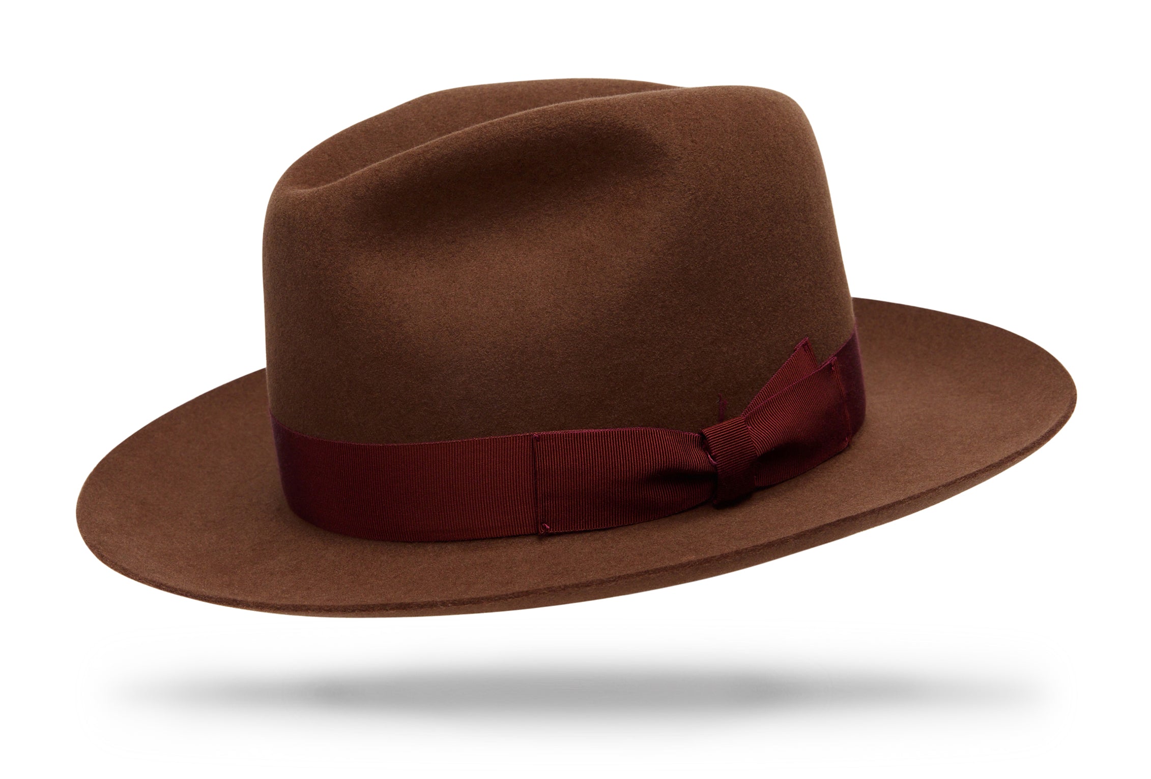 
Design
Our new spin on our timeless classic, the Sienna carries a 4 C-crown and holds a 3 snap brim. Substantial enough to battle the elements and cool enough to hit the streets. Should be a staple in your wardrobe.
Material
Fur felt, sustainably acquired.
Specifications
A 115-gram fur felt beauty. The Sienna holds a 3 snap brim with a classic 4 C-crown. A refined cacao, harmonized with a rust double bow hatband.Handcrafted in our NYC atelier.