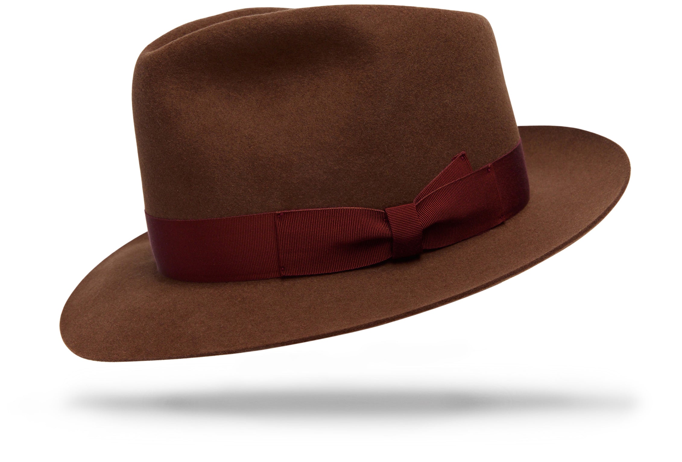Design
The Roma Cacao is a distinctive classic. Made out of 100% hare fur felt, It boasts a 2 ½” brim and a 4 crown and a 1 ¼” tone-on-tone hatband. A timeless design refined with style.
Material
100% hare fur felt, sustainably acquired
Specifications
- 100% hare fur felt.- 4” crown and a 2 ½” brim complete with a- 1 ¼” hatband. - Handcrafted in our NYC atelier with love.