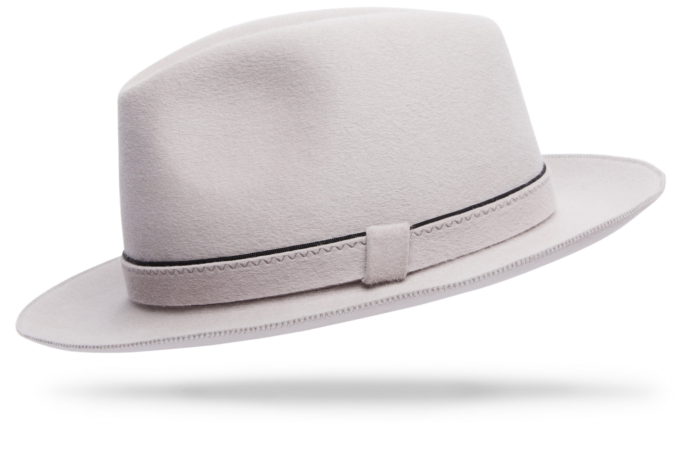 Design
Like a chip off an iceberg in Greenland... A white italian cashmere hat with pink overtones and cool blue undertones... Made of 100% lustrous cashmere, the Firenze fully embodies luxury chic.
Material
100% Italian cashmere
Specifications
The felt-on-felt hatband with its contrast complimentary edging takes detail oriented to the next level while the 2 3/8” brim and moderate crown effortlessly exude quality. Handmade in our atelier in NYC .