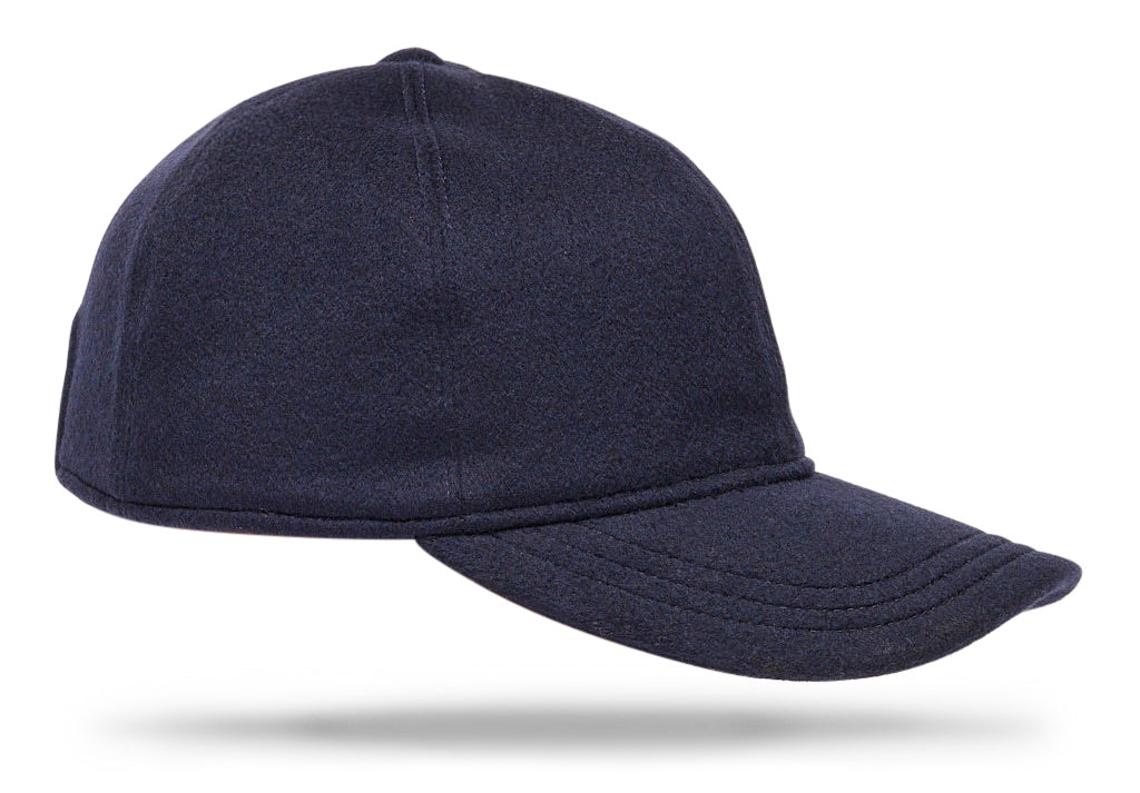  
Design
A refined and upgraded version of a timeless baseball cap for a modernized sportswear aesthetic. Crafted from 100% navy cashmere, this exquisite cashmere cap is constructed from six panels with a curved brim and is thoroughly made waterproof and wind-resistant. Ideal for leisure time teamed with casual outerwear. The perfect casual-luxe accessory for any ensemble.
Material
100% cashmere.
Specifications
100% navy cashmere.Rain waterproof fully lined for comfort.Handmade in Italy for Worth & Worth.
