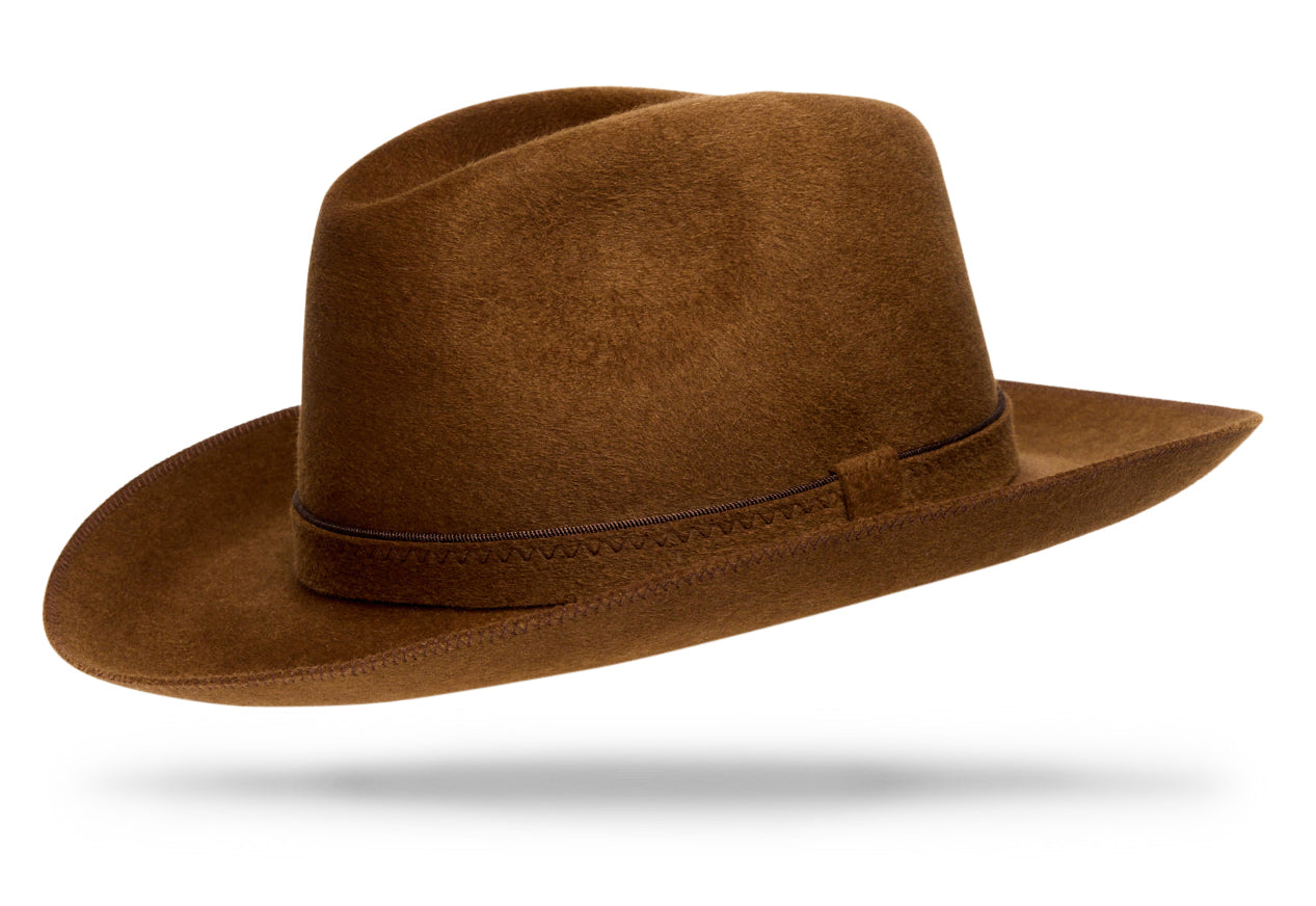 
Design
A brown Italian cashmere hat with rich caramel undertones.Made of 100% lustrous cashmere, the Firenze fully embodies luxury chic.
Material
100% Italian cashmere
Specifications
- The felt-on-felt hatband with its contrast complimentary edging takes a detail-oriented to the next level while the 2 3/4” brim and moderate crown effortlessly exude quality. - Handmade in our atelier in NYC.