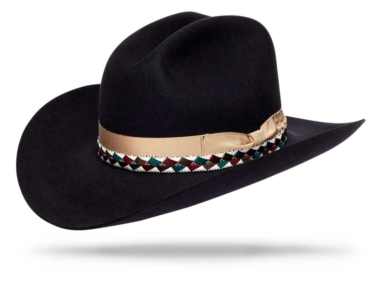 Design
A daring flair with a story to tell —  The Highwayman's  bold cattleman crown and cowboy brim carry the defiant air of an outlaw, yet its elegance belongs to the open road at dusk. The handwoven Peruvian band, with its intricate geometric pattern, grounds the piece in craftsmanship and tradition. Crafted in dressed felt, it holds the presence of a story long retold: the outlaw who moved through the night with the bearing of a poet.
Material
100% Dressed Beaver Fur Felt Hat sustainably acquired. 
Specifications
- Cattleman crown 4 1/4- Cowboy brim 3 1/2 - Finished with a contrasty ivory gros grain and an handwoven peruvian band - Handcrafted in our atelier in NYC. 