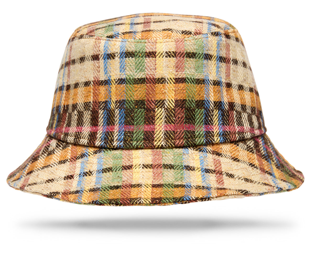 Design
A playful and distinctive take on the classic bucket hat, crafted from a richly textured blend of linen, wool and silk. Its colorful woven pattern gives each hat a unique sense of character, bringing an unexpected and modern spirit to the timeless silhouette.Woven in County Donegal, Ireland, drawing on generations of textile expertise, the cloth is then brought to Italy, where each hat is handmade by skilled artisans.Lightweight, relaxed and full of personality, this special piece combines exceptional craftsmanship with an effortless sense of fun.
Material
77% Linen · 11% Wool · 7% Polyamide · 5% Silk
Specifications
- 77% Linen- 11% Wool - 7% Polyamide - 5% Silk- Woven in Ireland - Handmade in Italy