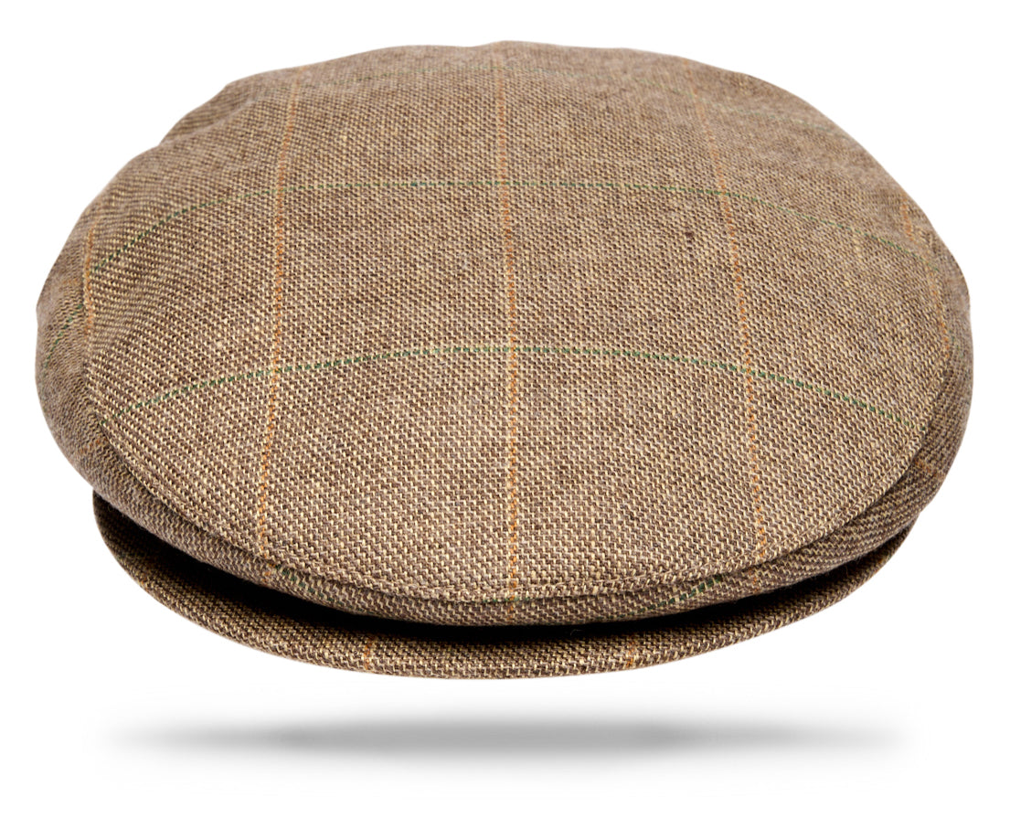 Design
Our most popular classic cap, inspired by the traditional British flat cap and reimagined in an exceptional blend of merino wool, silk and cashmere. Selected by Worth & Worth for its softness, warmth and subtle texture, the fabric is woven in County Donegal, Ireland, drawing on generations of textile expertise.
The cloth is then brought to Italy, where each cap is handmade by skilled artisans. Fully lined for comfort and designed to fold easily into your pocket, the Ivy Cap combines timeless character with refined craftsmanship and effortless versatility.
Material
75% Merino Wool 15% Silk 10% Cashmere  
Specifications
- 50% Merino Wool- 50% Linen- Blue Windowpane- Fully lined.- Woven in Ireland - Handmade in Italy for Worth & Worth.
