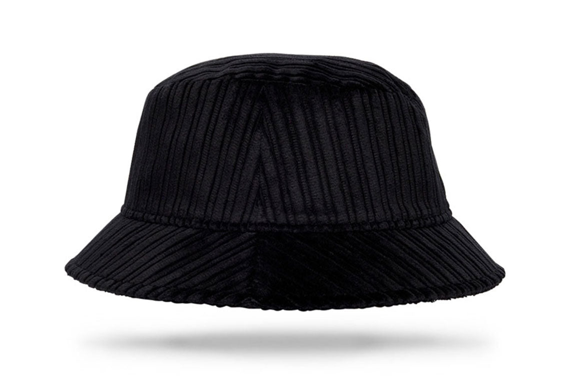 Design
All black. All season. Our 100% cotton corduroy bucket hat brings texture, warmth, and attitude to colder days. Soft, packable, and made for movement — it folds, travels, and returns to form with ease. Handcrafted in our New York atelier from fine-wale corduroy, it’s a versatile piece built for both city and escape. Whether you’re out in the elements or keeping it casual indoors, this hat is your go-to companion.
 
Material
100% black cotton corduroy
Specifications
- 100% black cotton corduroy- Soft, warm, and built for the colder months- 2” brim offers comfortable coverage — from low winter light to brisk city walks- Handcrafted in our atelier 