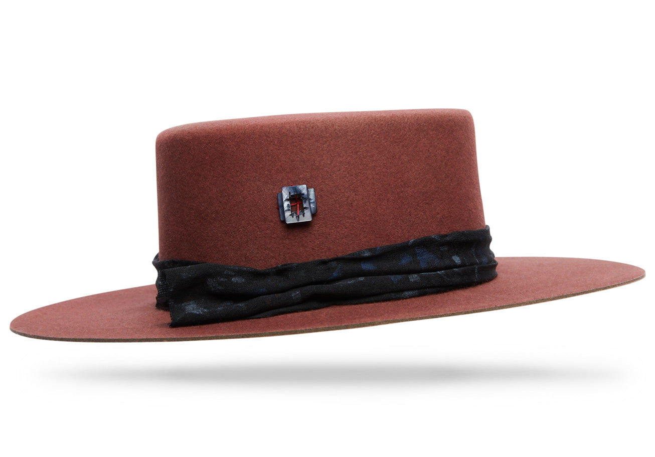 Design
Named after the salt flats of the western tip of Sicily. A unique ashy pink with warm gray undertones and medium rose overtones...
Material
100% Western Beaver Fur Felt Hat triple dyed sustainably acquired
Specifications
4 flat top bolero crown with 3 1/2 table top brim. Handmade in our atelier in NYC. Please allow 2-4 weeks to custom make this special piece.