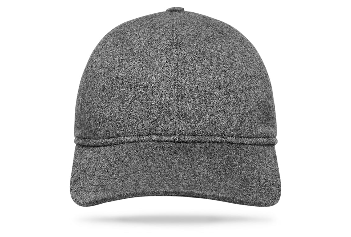 
Design
A refined and upgraded version of a timeless baseball cap for a modernized sportswear aesthetic. Crafted from 100% grey cashmere, this exquisite cashmere cap is constructed from six panels with a curved brim and is thoroughly made waterproof and wind-resistant. Ideal for leisure time teamed with casual outerwear. The perfect casual-luxe accessory for any ensemble.
Material
100% cashmere rain waterproof.
Specifications
- 100% Heather gray cashmere.- Fully lined for comfort.- Handmade in Italy for Worth & Worth.