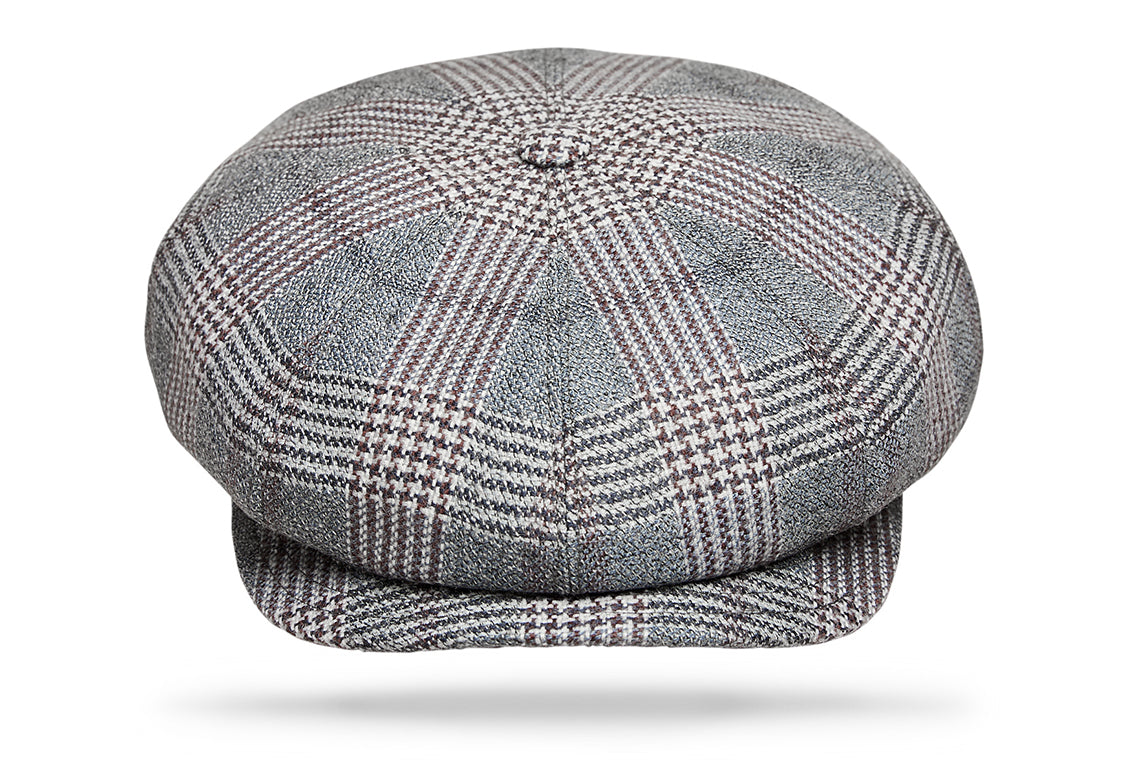 
Design
Commonly known as the Big Apple, the 8 paneled Gatsby invokes a boyish spirit with its matching button and sewn-down visor.Fully lined for comfort. Washed denim houndstooth plaid.
Material
100% pure Wool.
Specifications
100% pure Wool.Handmade in Italy for Worth & Worth.
