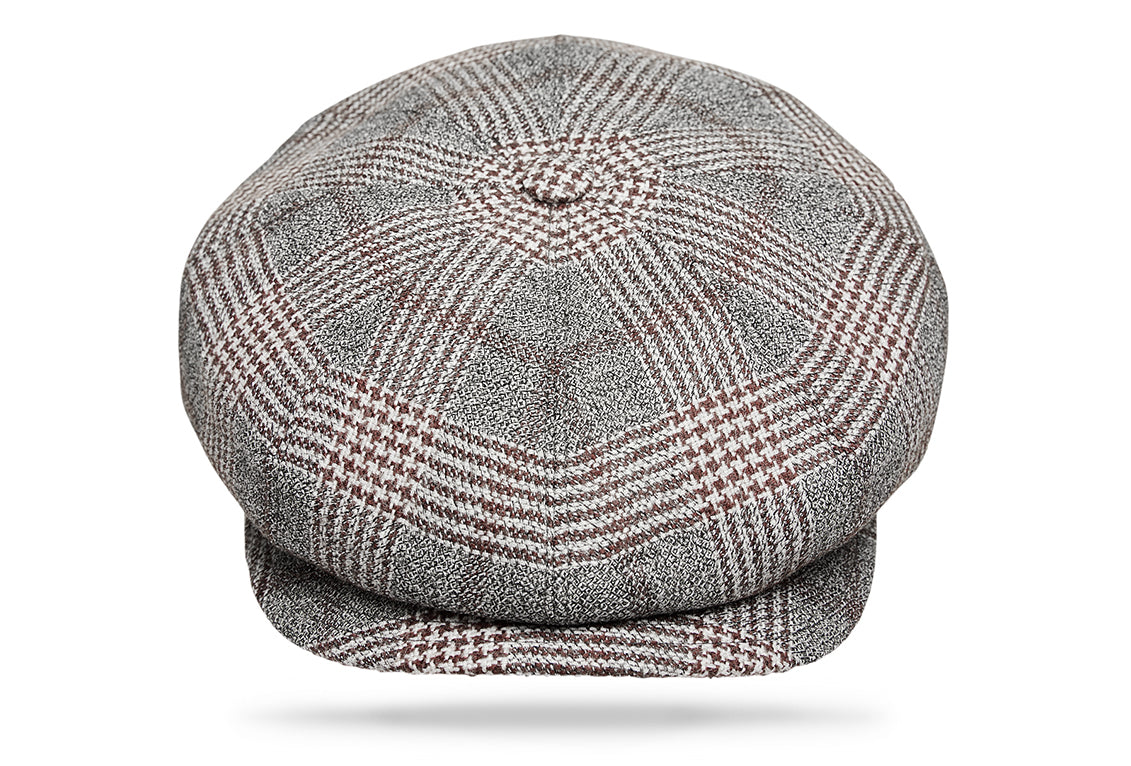 
Design
Commonly known as the Big Apple, the 8 paneled Gatsby invokes a boyish spirit with its matching button and sewn-down visor.Fully lined for comfort. Warm Houndstooth plaid
Material
100% pure Italian Wool.
Specifications
100% pure Italian Wool.Handmade in Italy for Worth & Worth.
