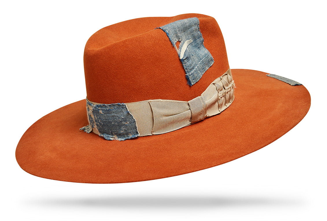 Design
100% Light Weight Dressed Beaver Fur Felt. A vibrant tangerine adorned with handwoven antique french cotton and Venetian glass beads. A beautiful custom piece made to last a lifetime.
Material
100% Light Weight Dressed Beaver Fur Felt Hat sustainably acquired.
Specifications
A 4 1/2 5 points crown with 3 1/2 slightly curved brim. Adorned with handwoven antique french cotton and Venetian glass beads. Handcrafted in our atelier in NYC.Please allow 4-6 weeks to custom make this special piece.